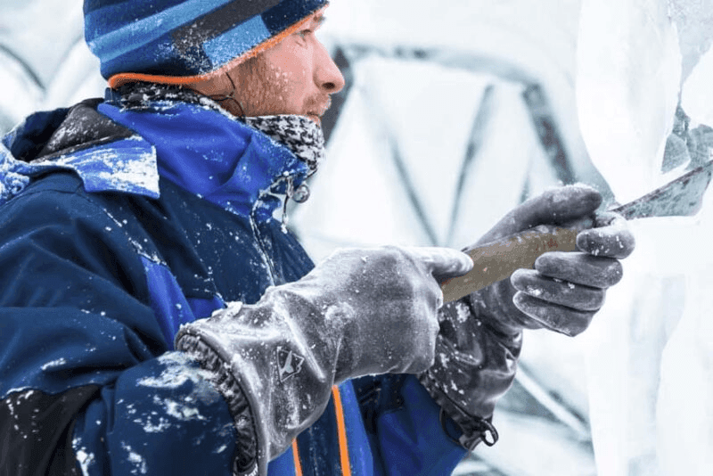 Man wearing durable work gloves working in the snow